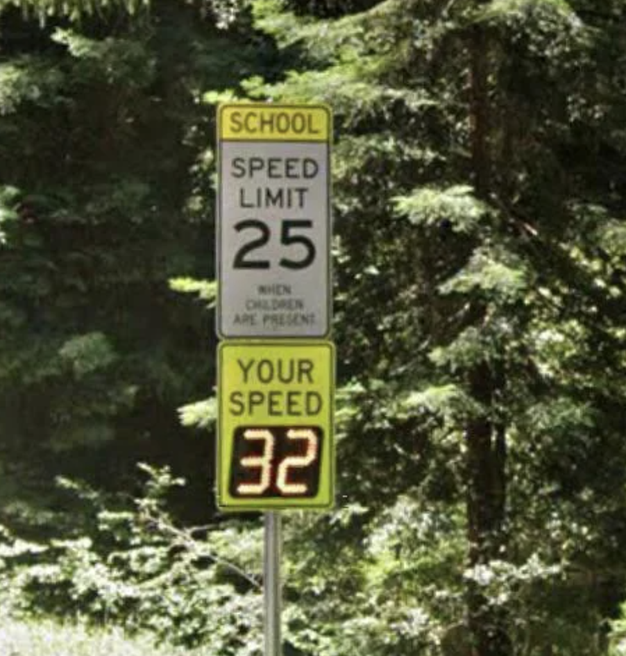 street sign - School Speed Limit 25 When Children Are Present Your Speed 32
